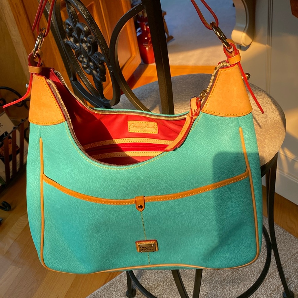 Dooney & Bourne 1975 stamped handbag.